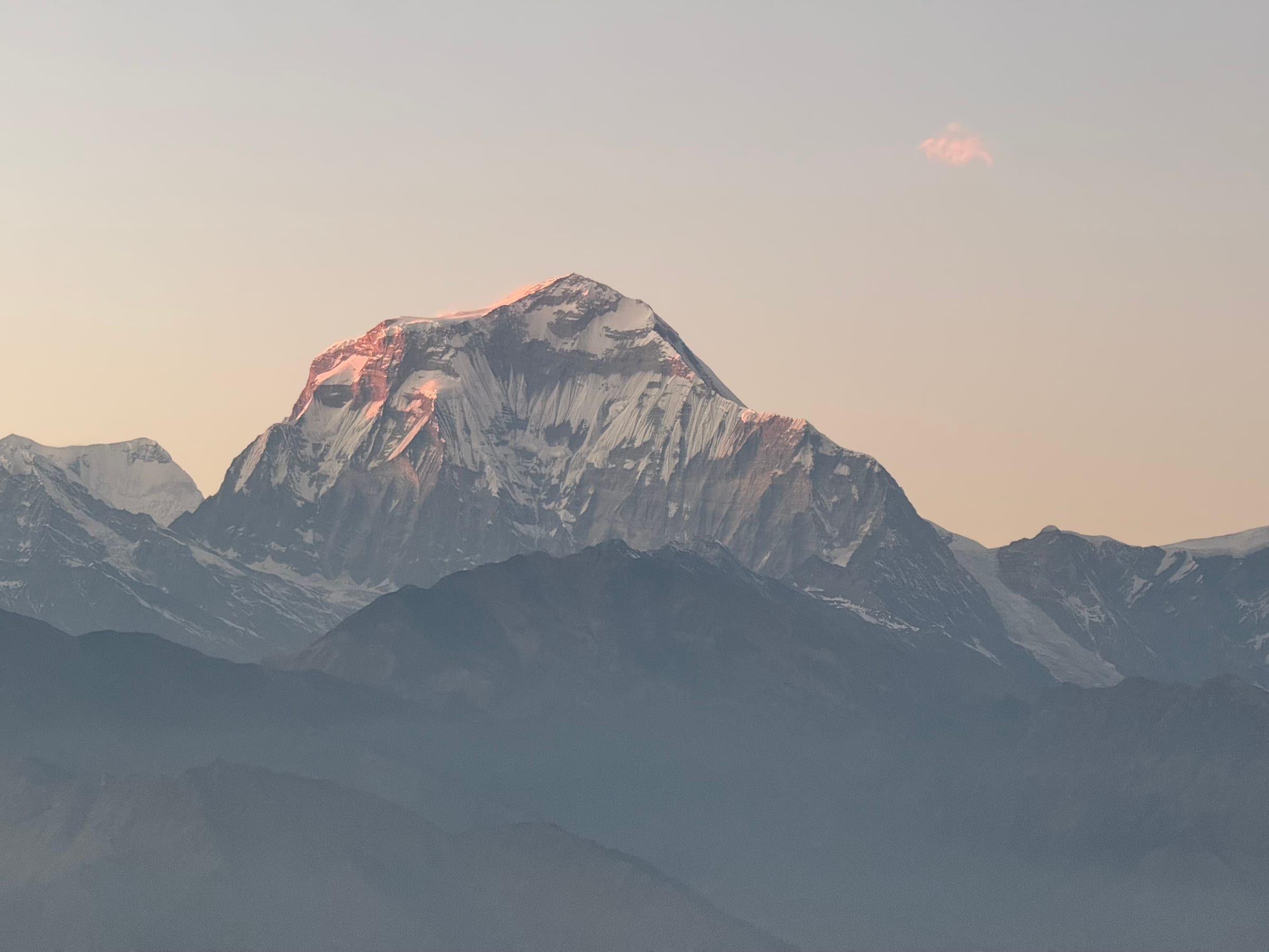 Close-up of the same sunset-lit peak, colours deepening