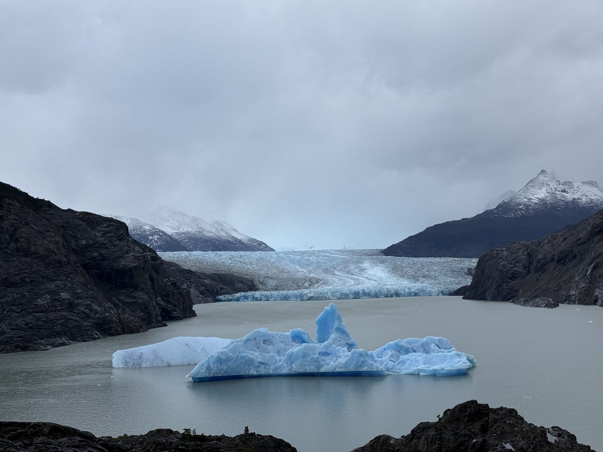Icebergs and glacier ice in muted grey light